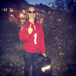 Woman wearing a 1 on her jacket