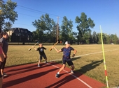 two youth ASRAB participants throwing a javelin